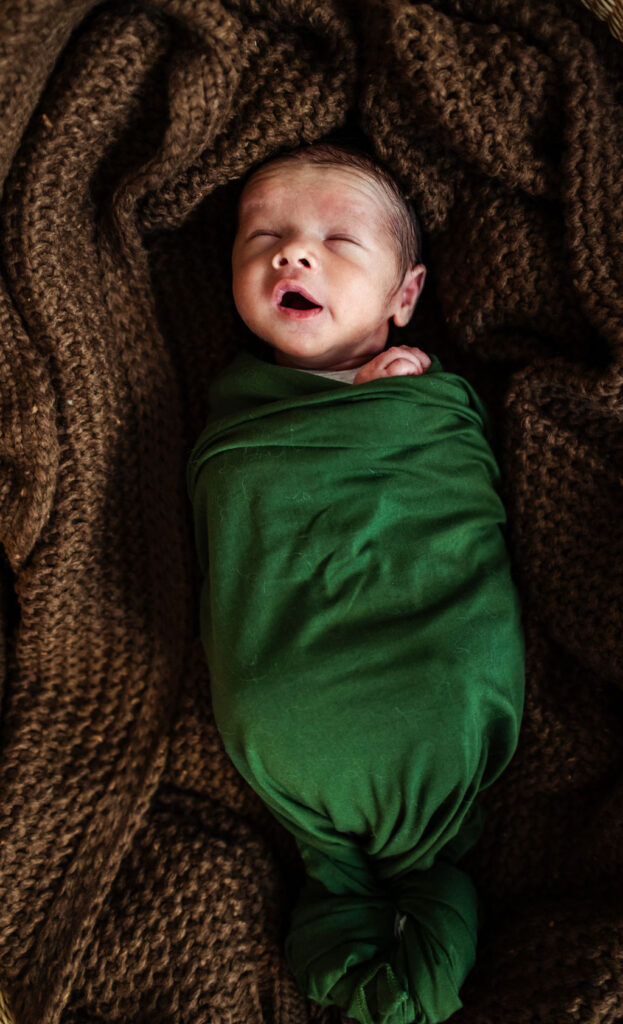 Newborn photography at home in green wrap
