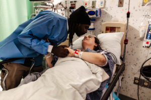 Dad kisses mom right after her c-section