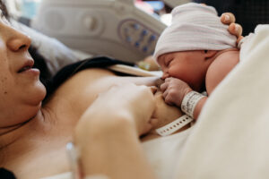 Baby breastfeeding for the first time after being born